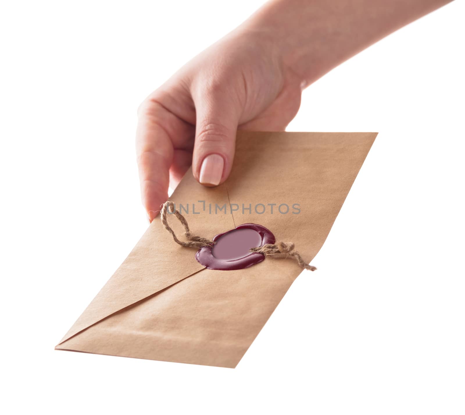 envelope in the hand on a white background isolated