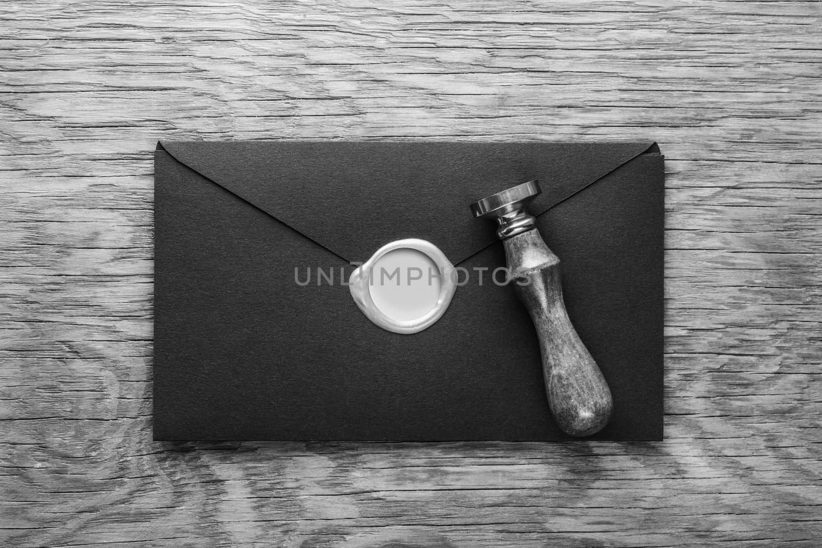envelope with a stamp on the wooden background