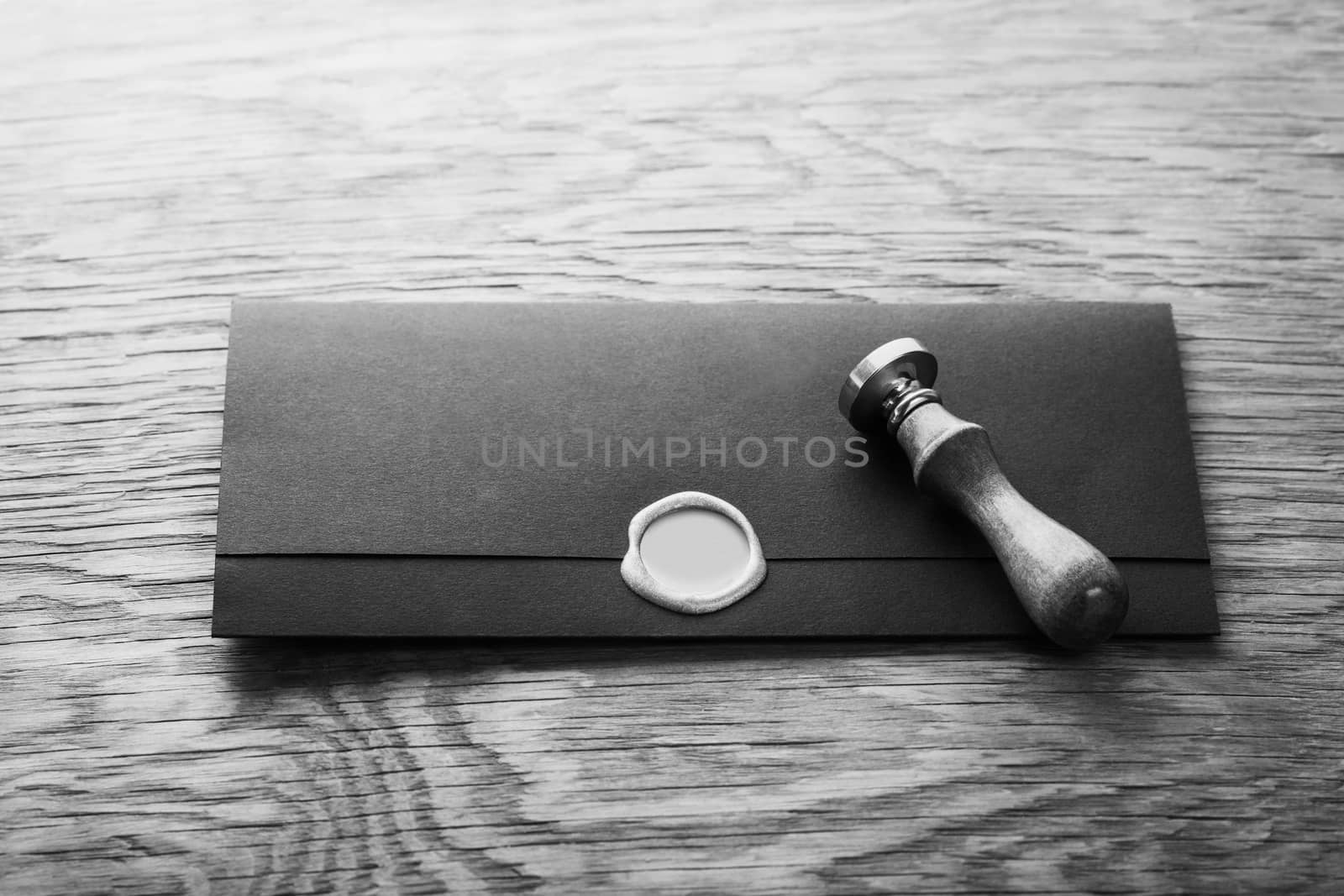 envelope with a stamp on the wooden background
