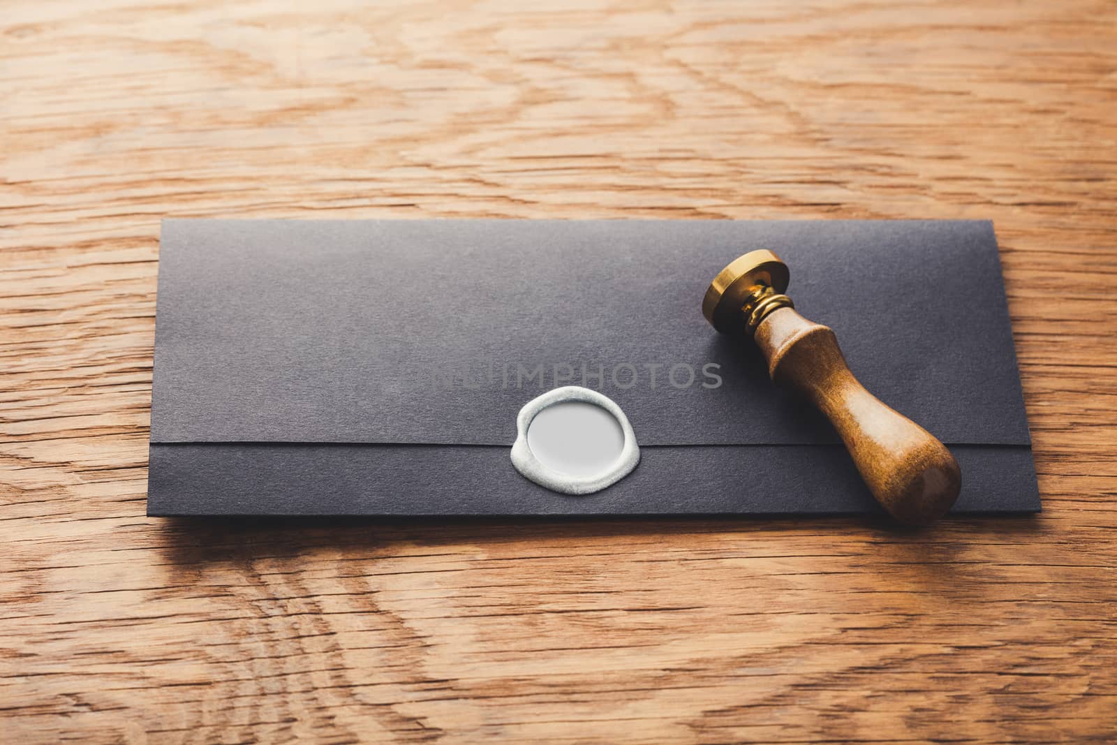 envelope with a stamp on the wooden background