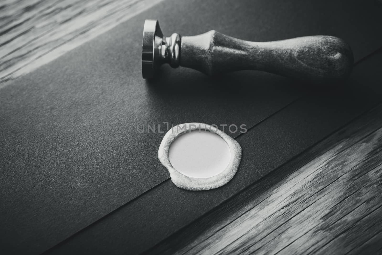 envelope with a stamp on the wooden background