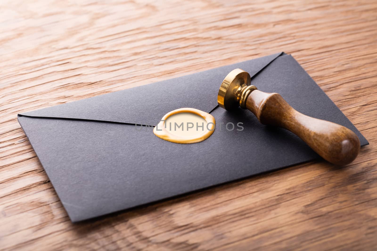 envelope with a stamp on the wooden background