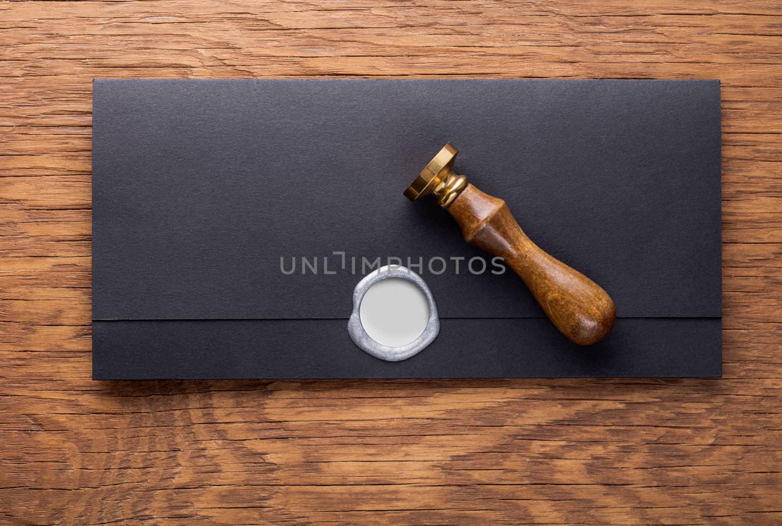 envelope with a stamp on the wooden background