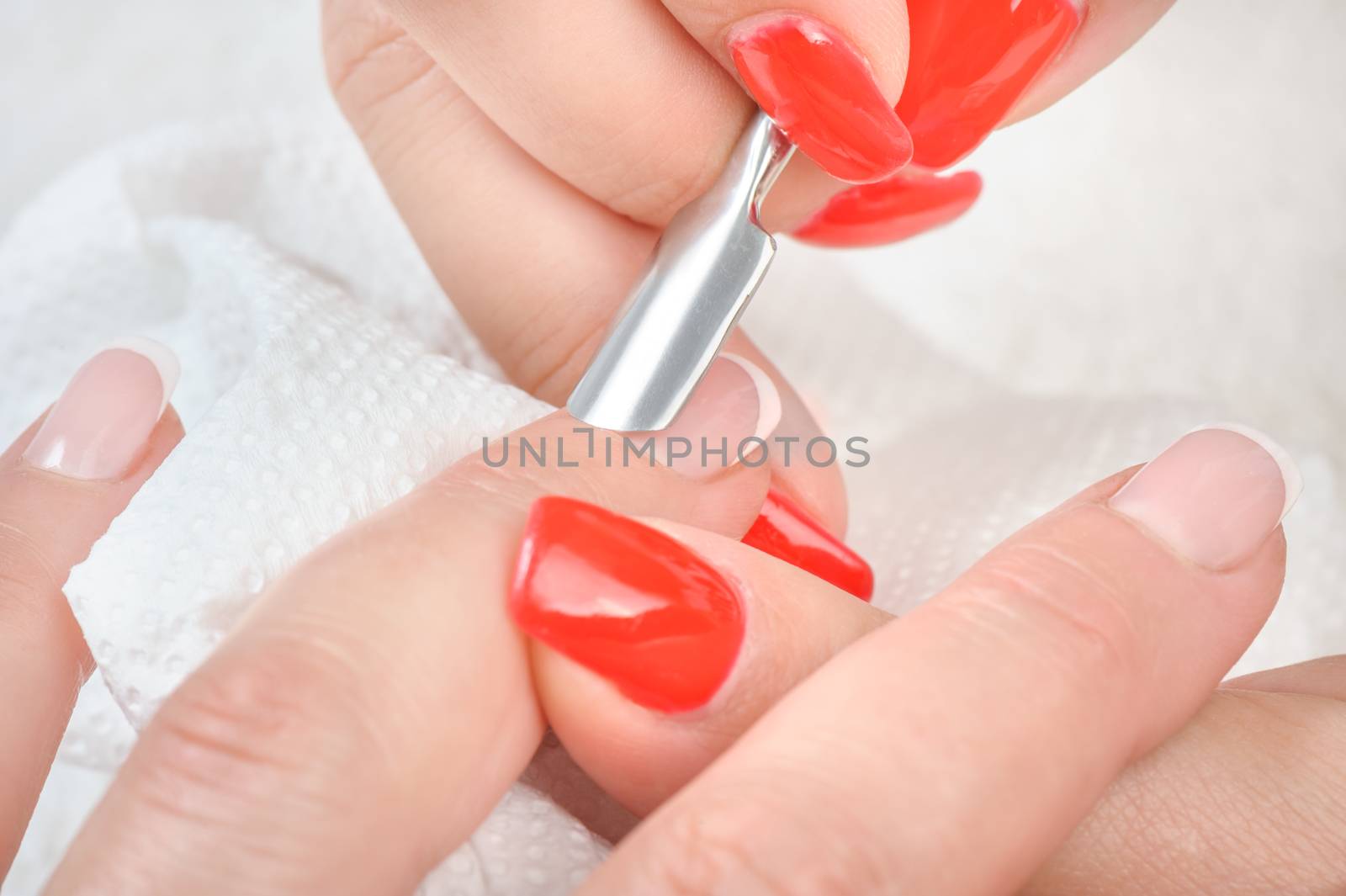 Nail salon, hands beauty treatment, cuticles care with metal cuticle pusher