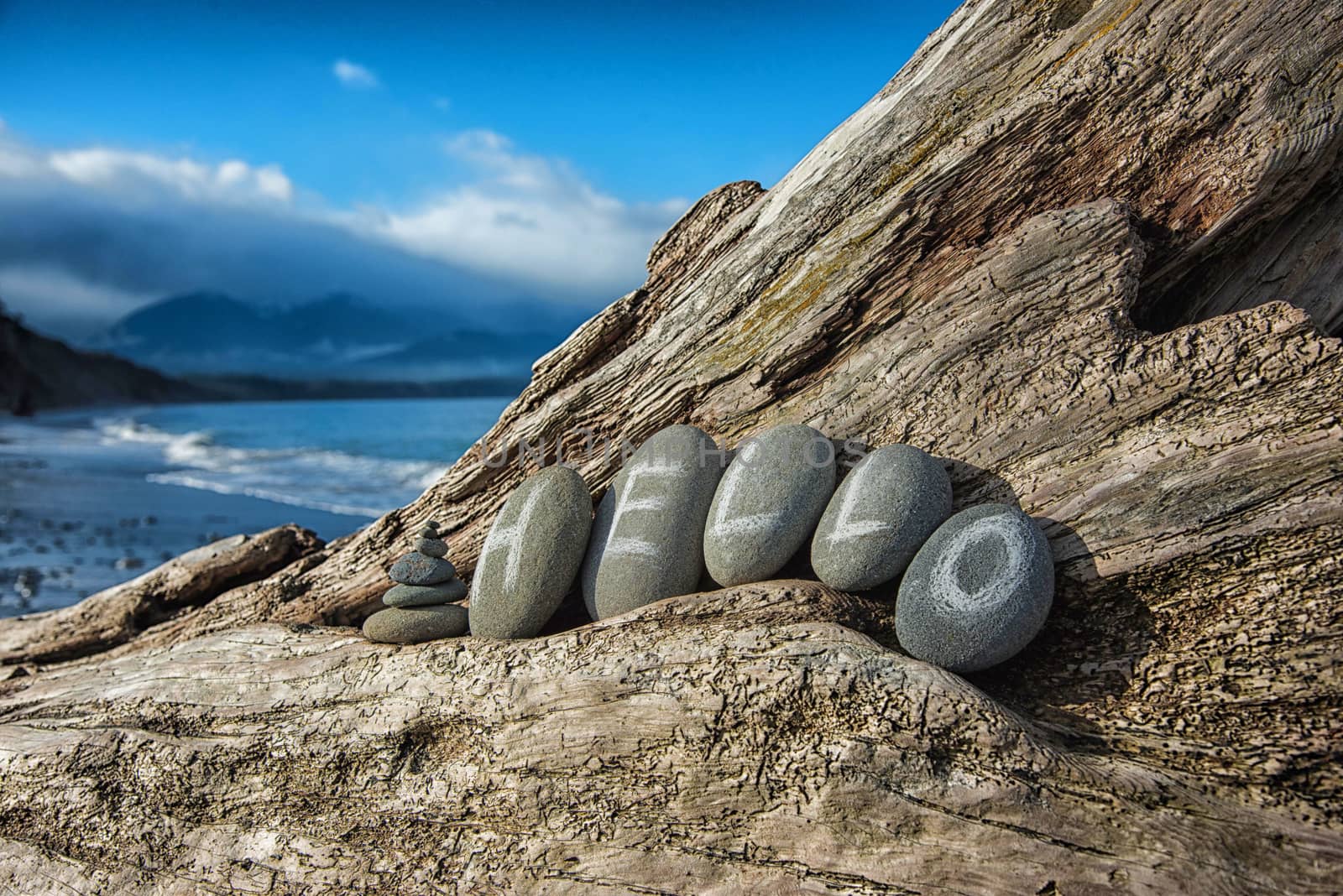 'hello' written in stones on driftwood by rongreer