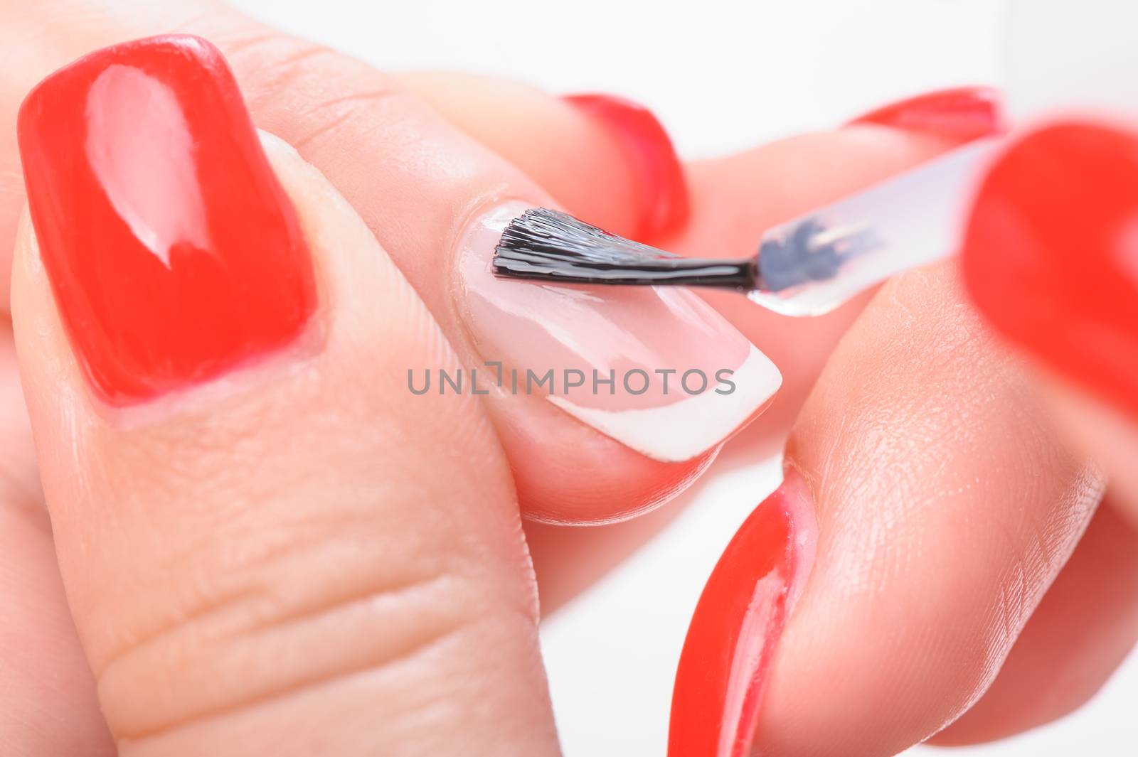 Manicure, covreing nails with transparent painting polish