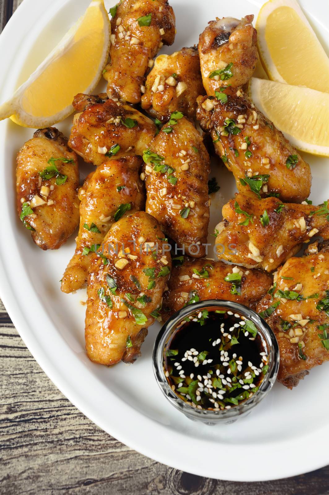 Fried chicken wings in ginger garlic marinade with herbs