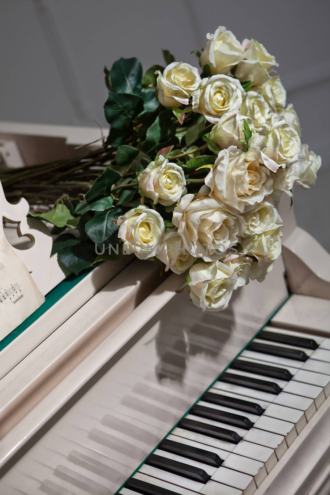 Bouquet of roses on the grand piano