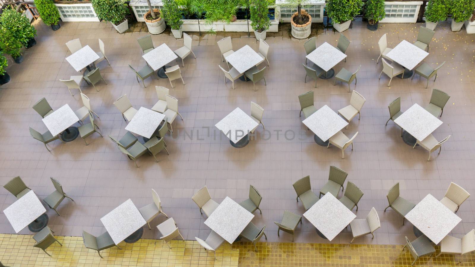 Outdoor top view of the empty chairs and table.