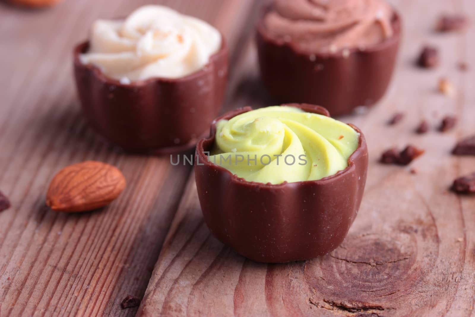 diffrent kinds of chocolate candy on wooden table