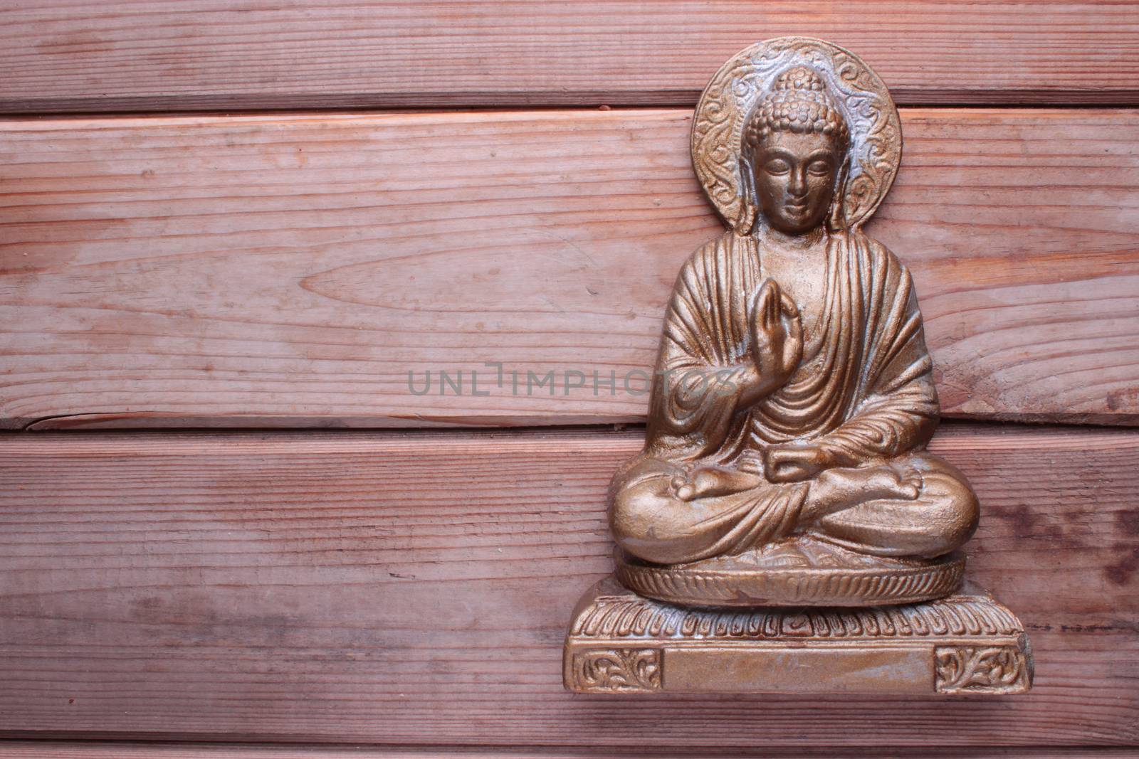 buddha on wooden table by liwei12