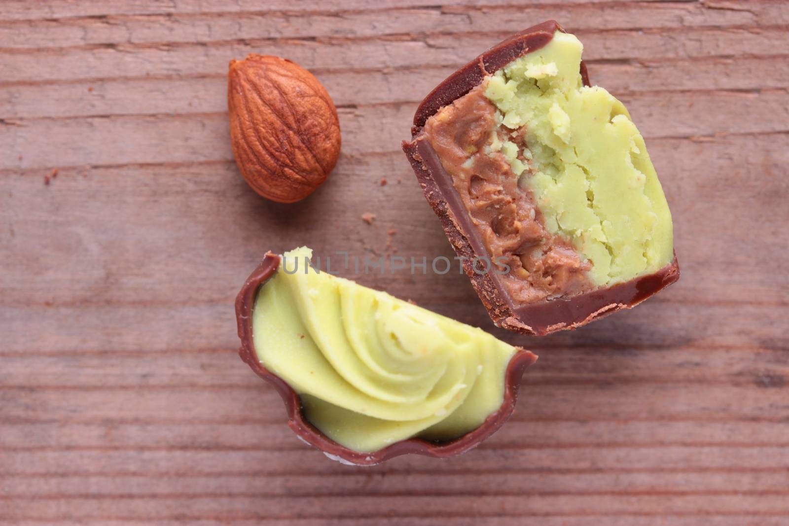 chocolate candy on wooden table by liwei12