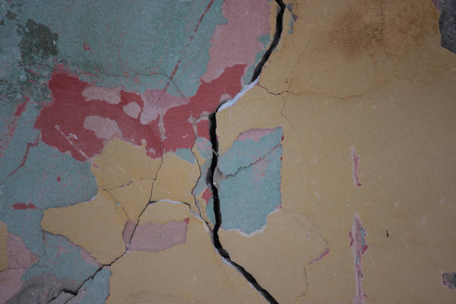 cracked colorful bright old wall close up
