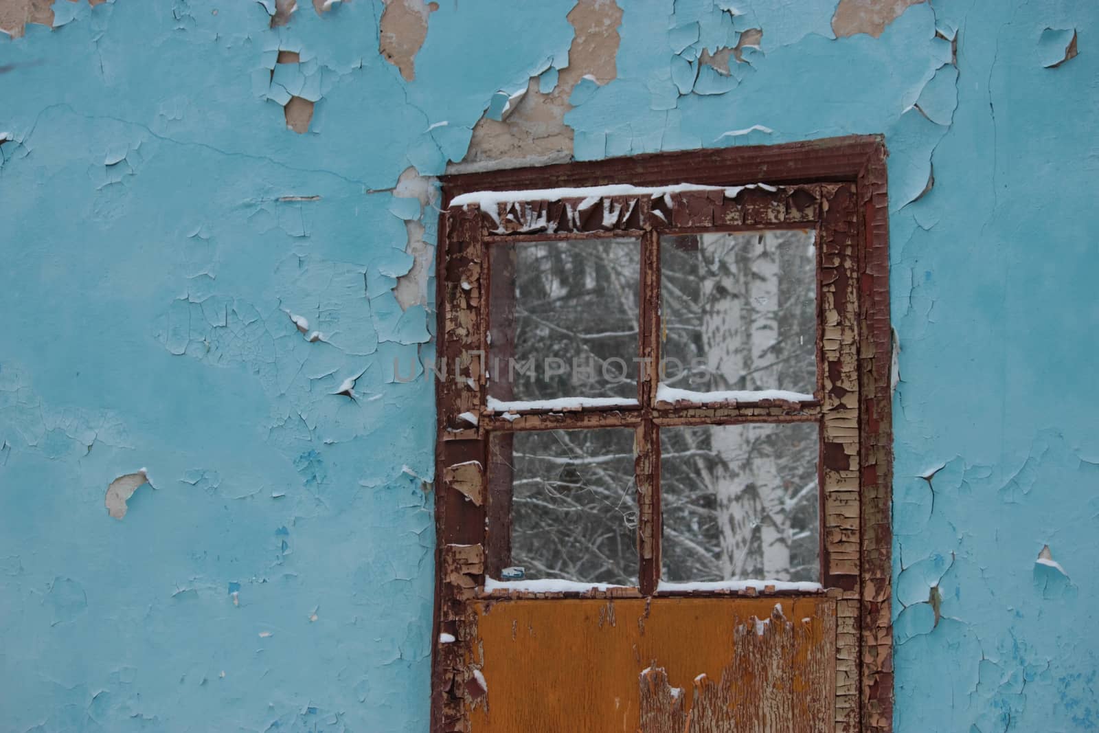 door in an old ruined house, blue wall