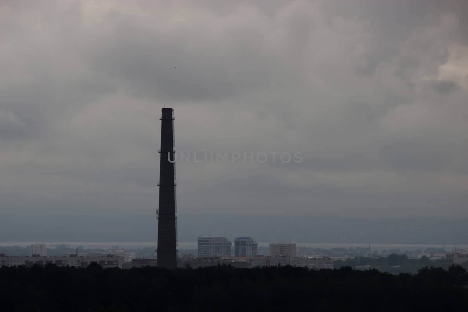 pollution concept, pipe on the cloudy sky background