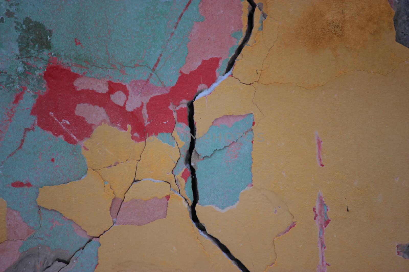 cracked colorful bright old wall close up