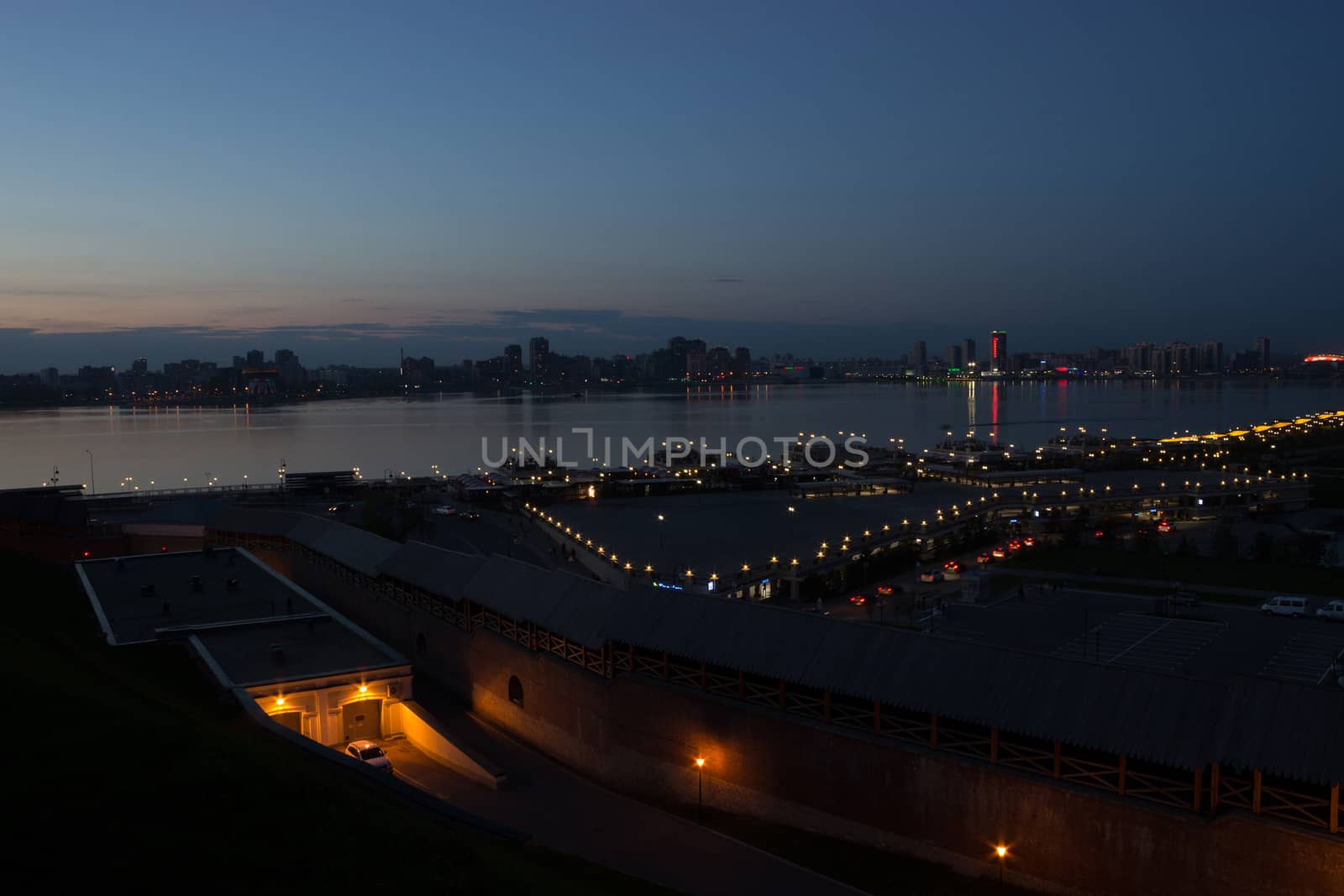 night city on the river, sunset sky