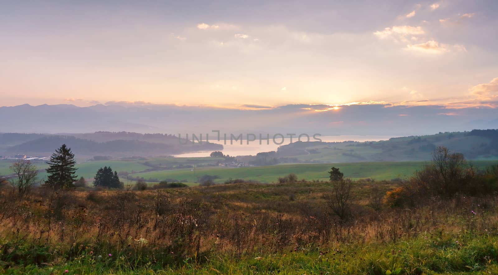 Slovakia autumn sunny morning panorama. Rural fall mountain scene. Village in valley.