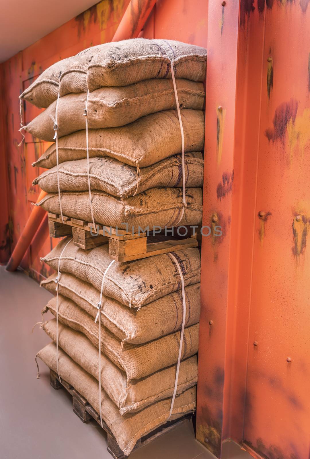 Pallets of merchandise bags stacked in storage by YesPhotographers