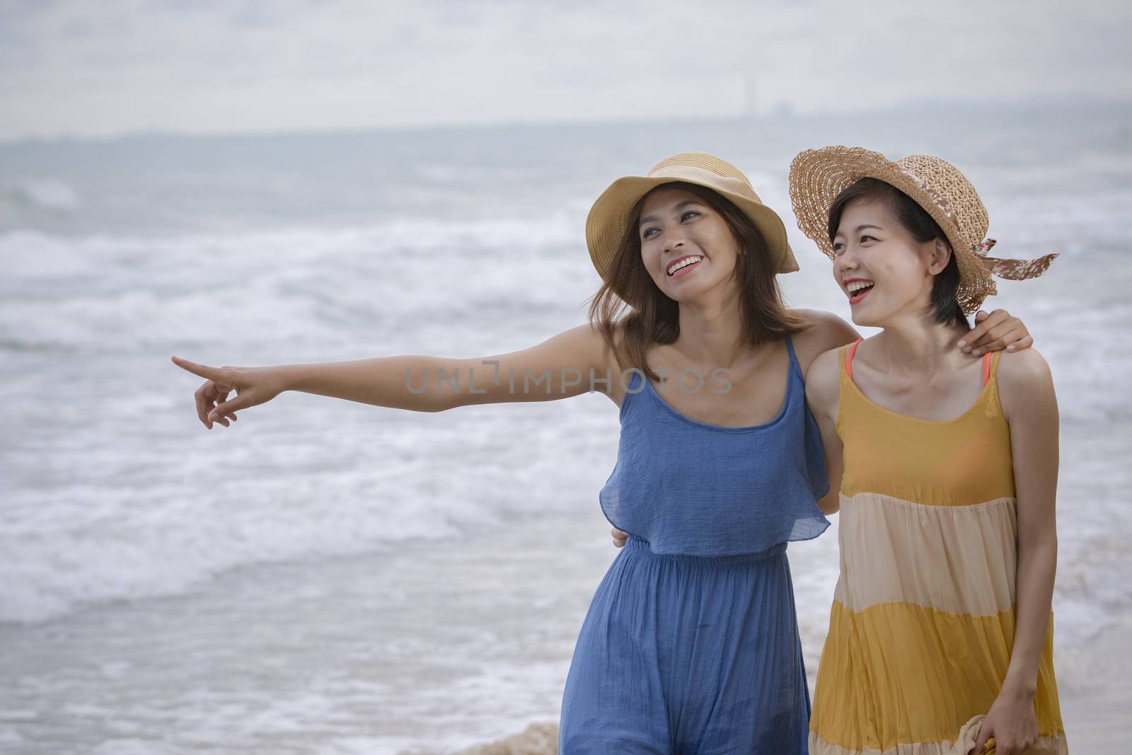 young asian woman friend relaxing emotion at sea beach summer vacation time