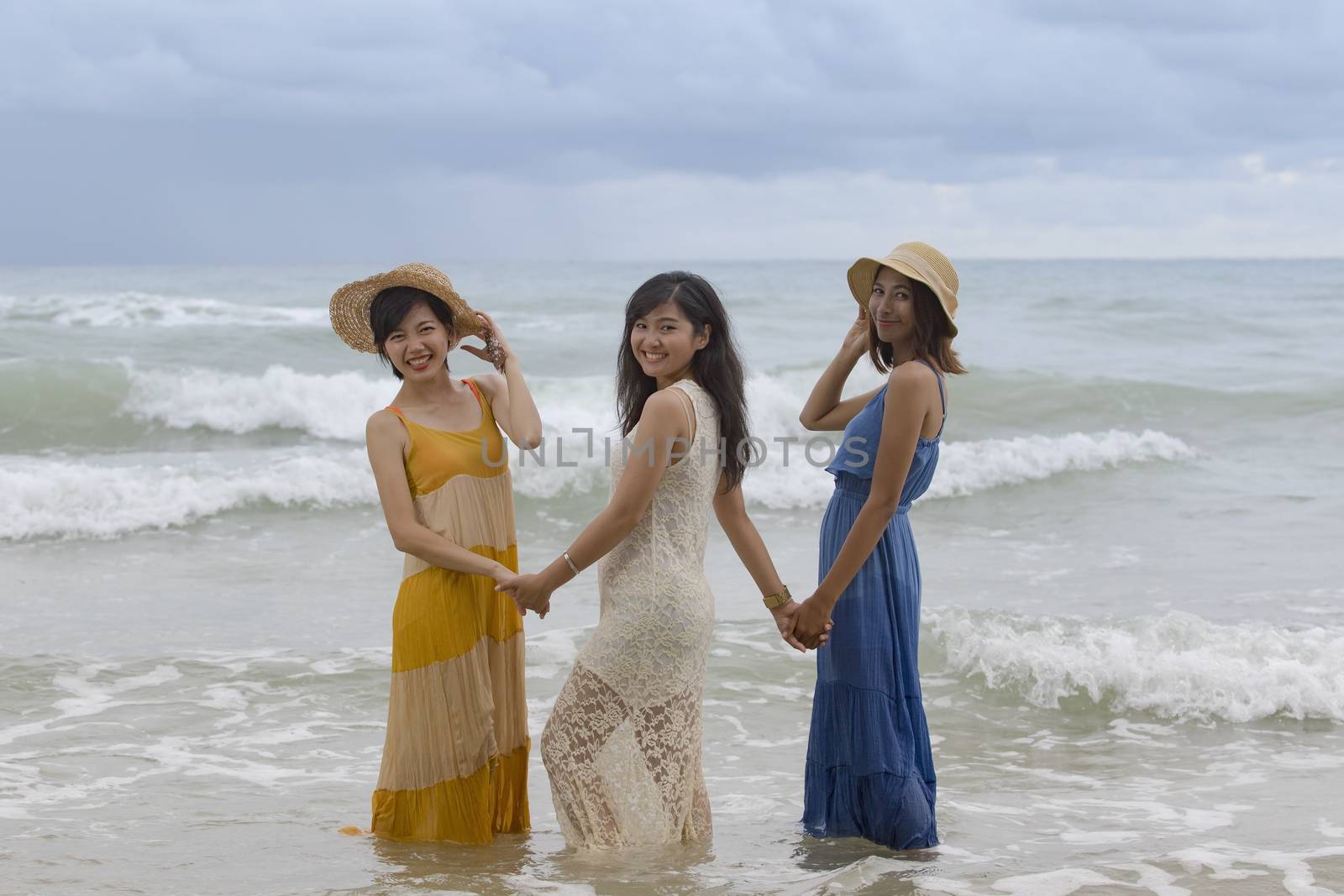 younger asian woman friend relaxing vacation time at sea beach happiness emotion