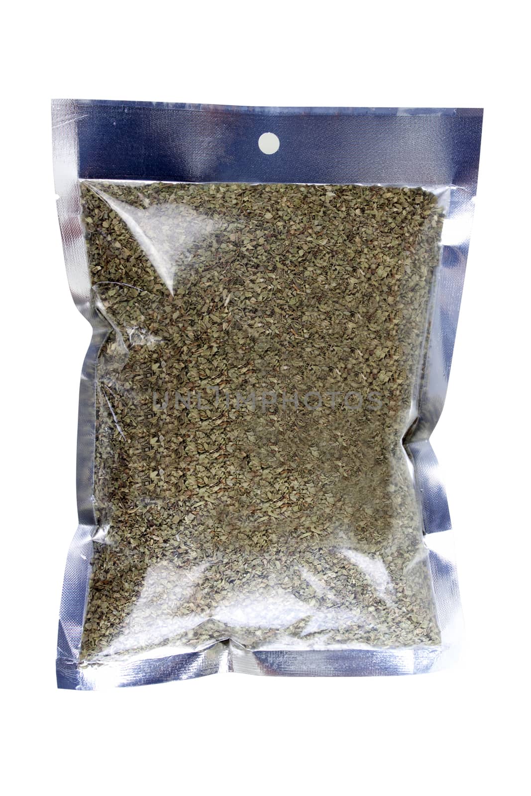 dried oregano (Origanum vulgare) in packaging foil. Isolated on white with clipping paths. 