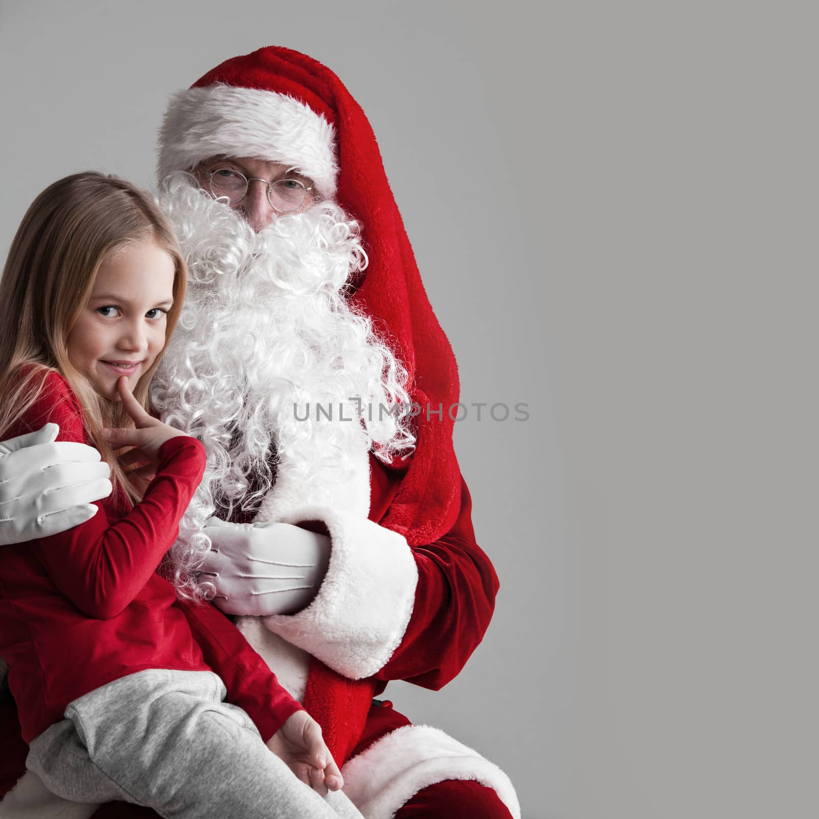 Smiling little girl with Santa Claus, Christmas concept
