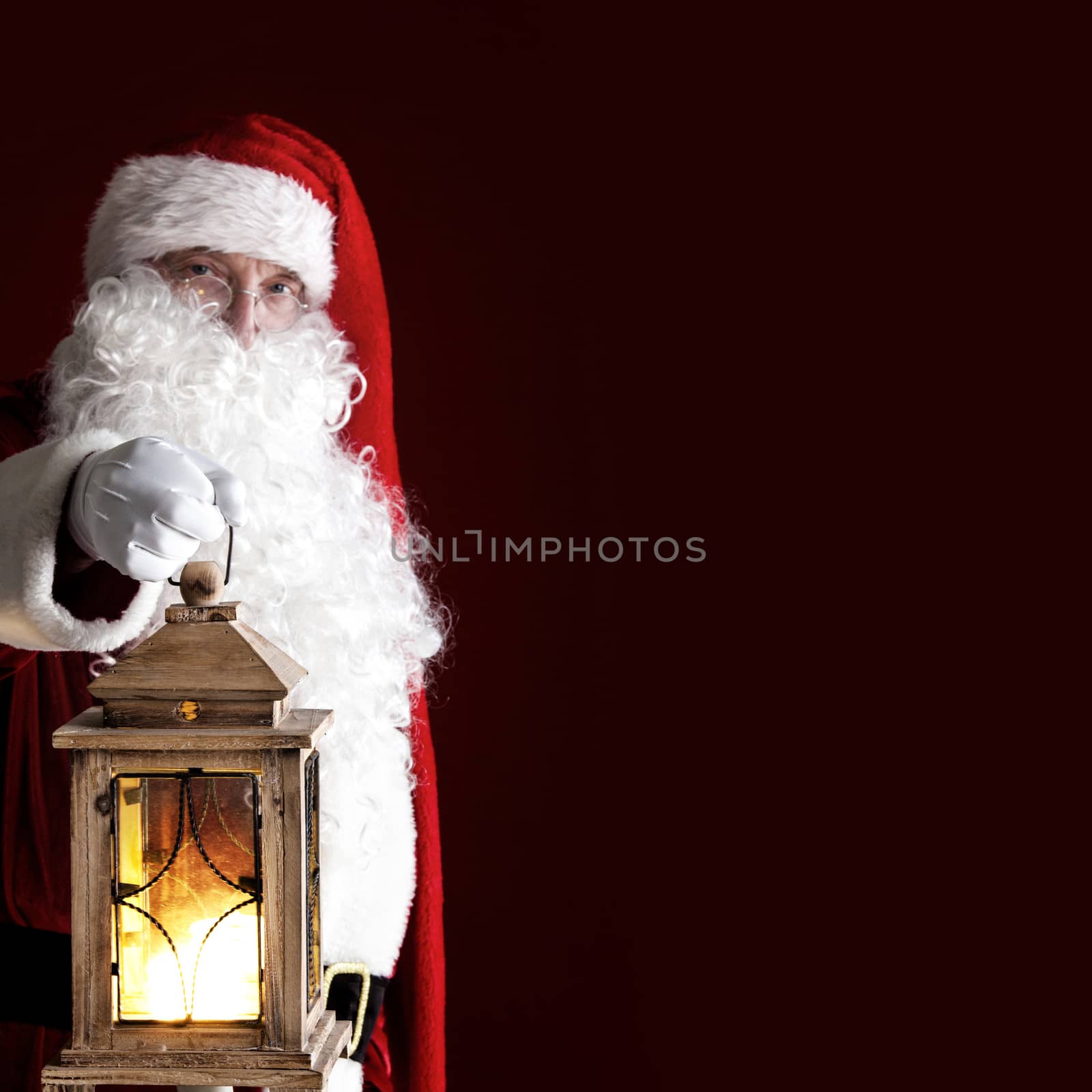 Santa Claus with old style vintage glowing Lantern