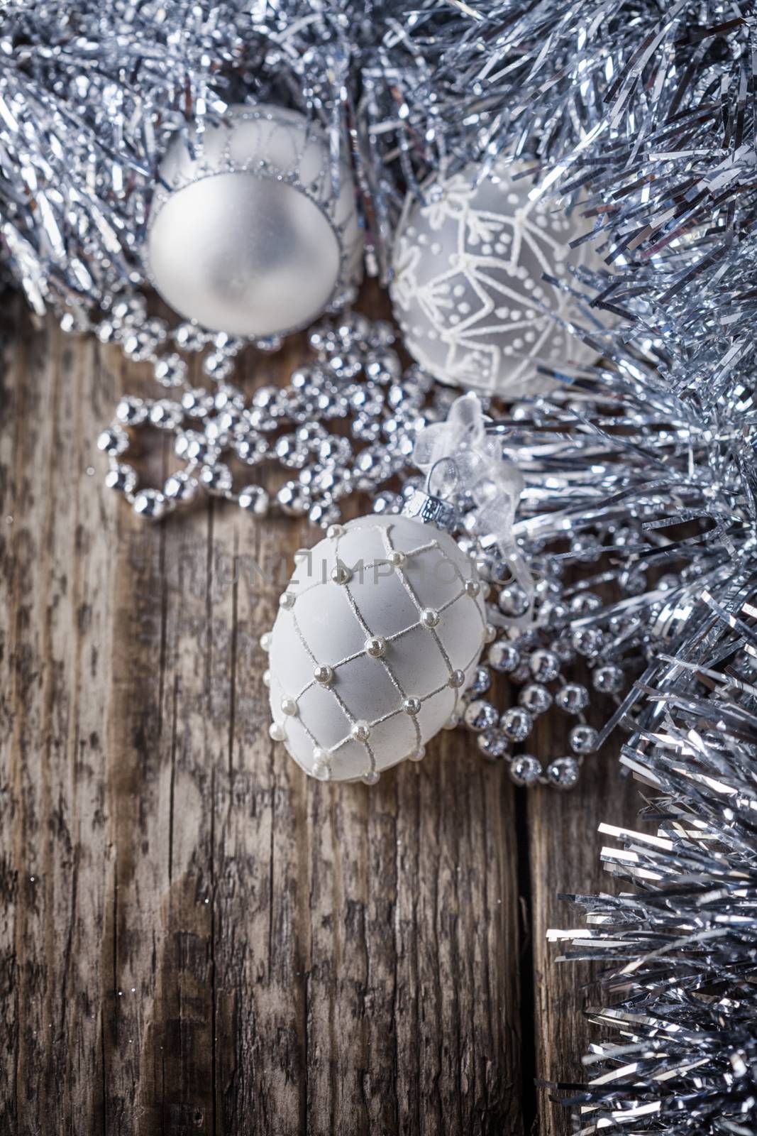 White christmas balls on a wooden background by supercat67