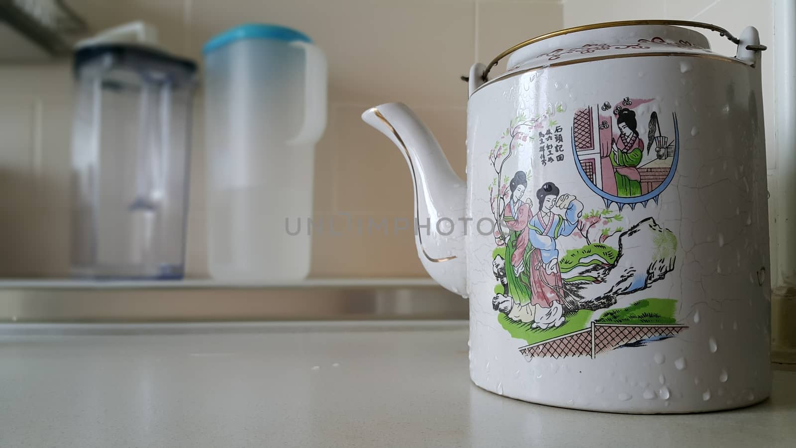 Chinese style tea pot in the kitchen. by s3410312