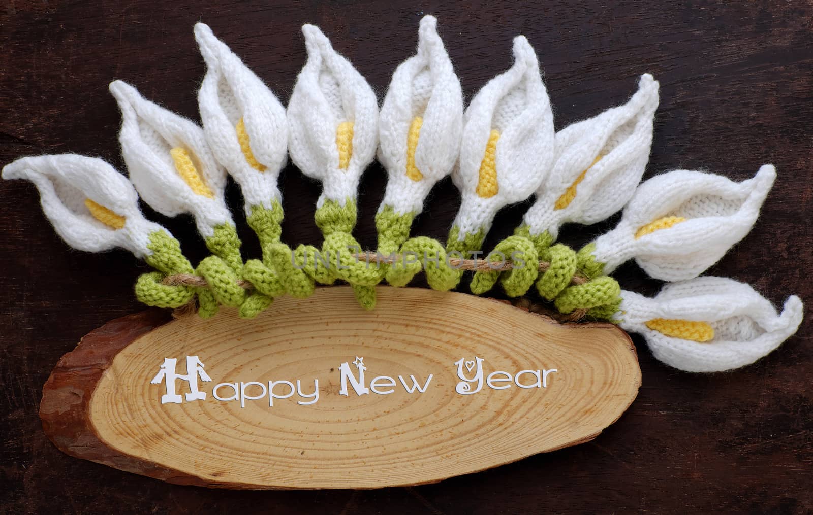 Amazing happy new year background from wood banner with nine of handmade white arum lily knit from yarn, diy home decor to make new year ornament in spring