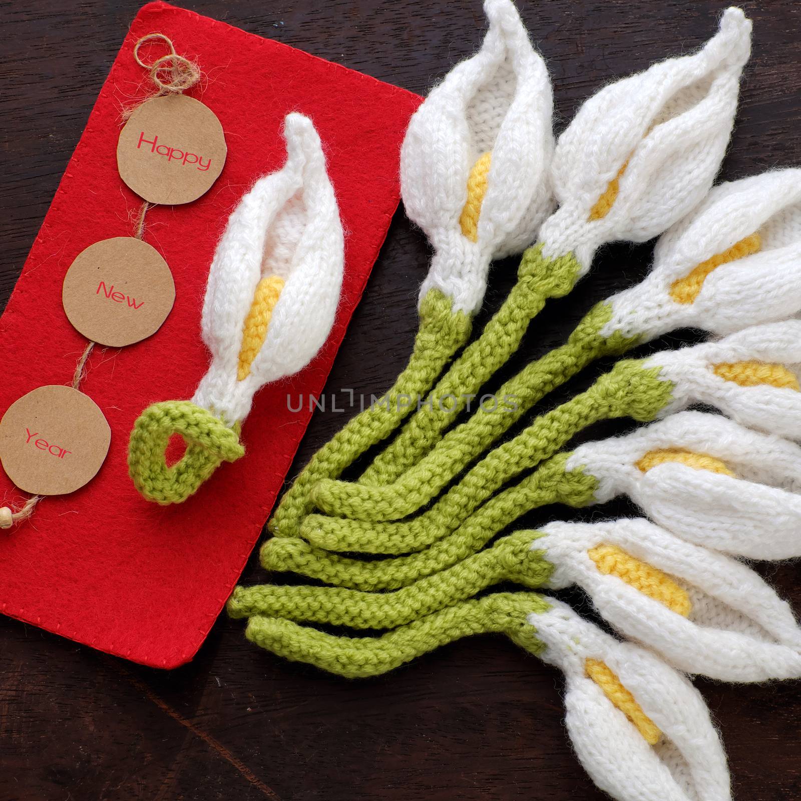 Amazing happy new year background from wood banner with nine of handmade white arum lily knit from yarn, diy home decor to make new year ornament in spring