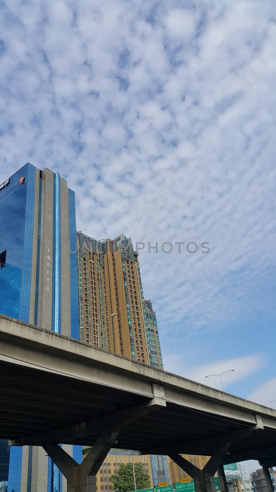 Bangkok, Thailand - November 28, 2016: Sun Tower, office building taken with the express-way. The photo also show the building's name in Chinese.