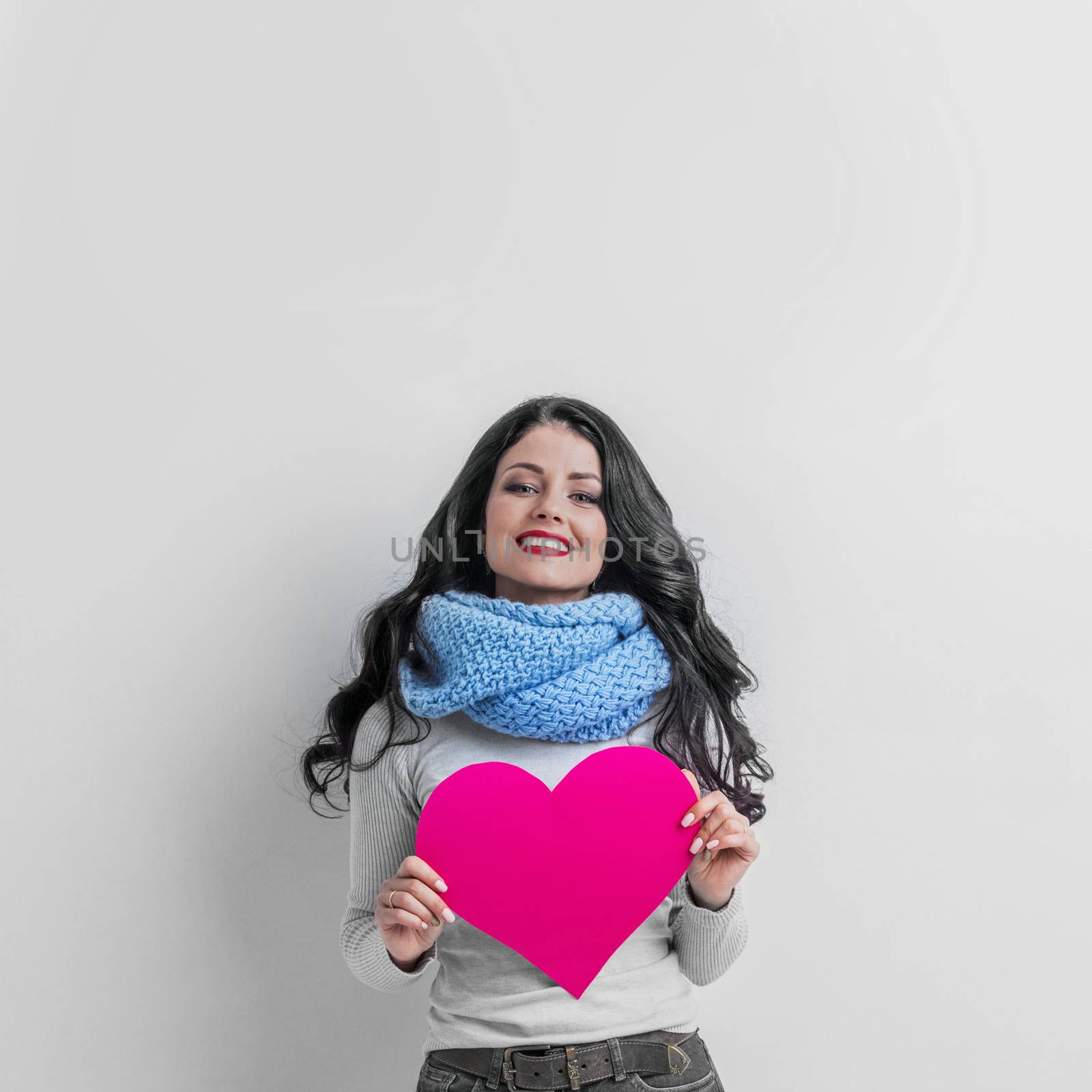 Valentines Day. Woman holding Valentines Day paper heart with copy space