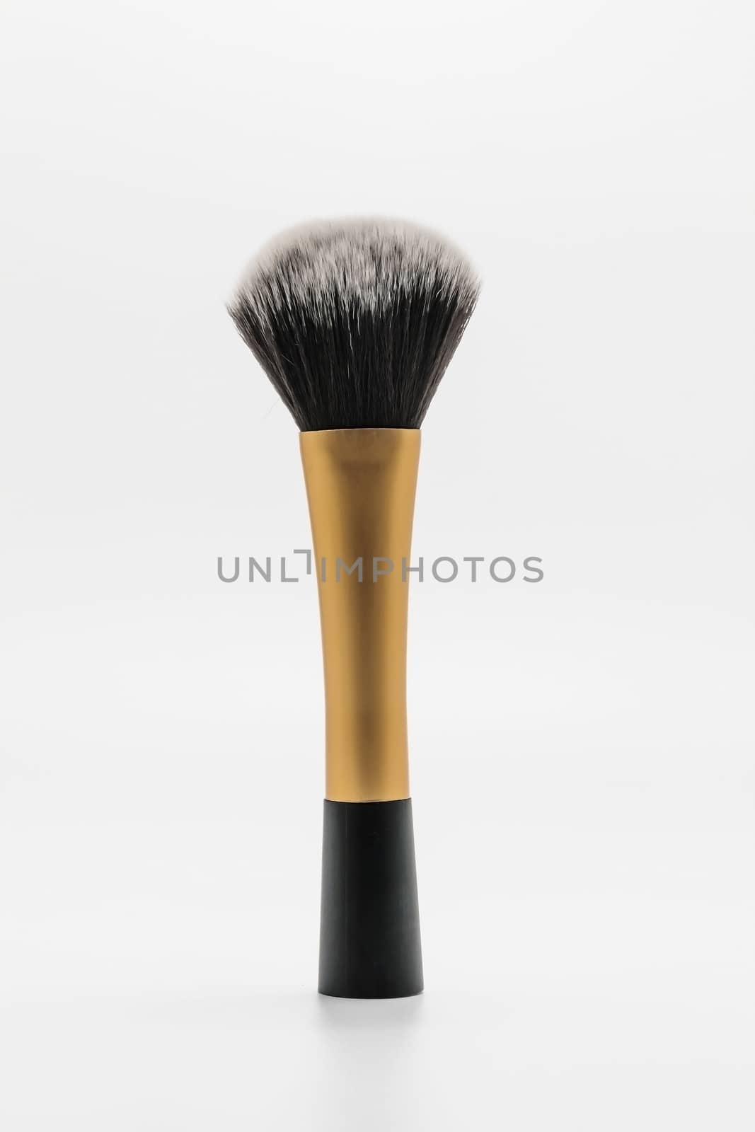 Brush for powder and blush isolated on white.