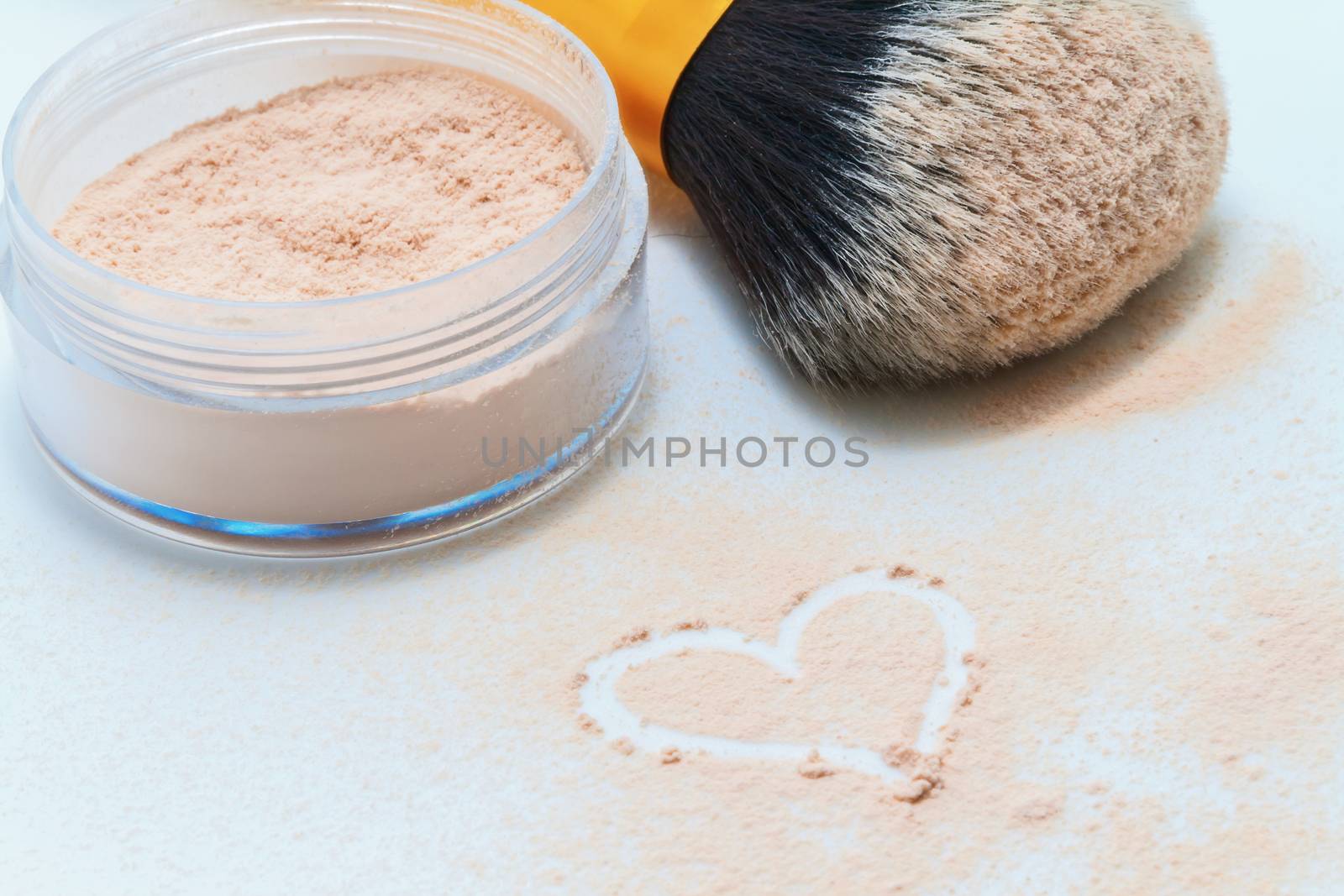 sprinkled powder, brush and drawing heart.