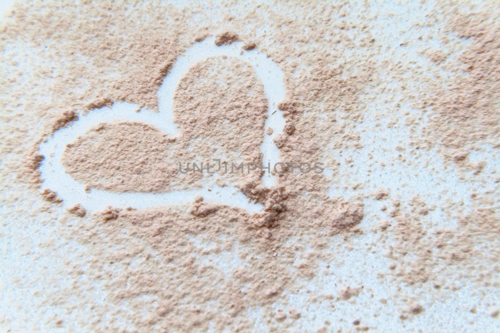 scattered powder on drawing a heart on a white background by Tanacha