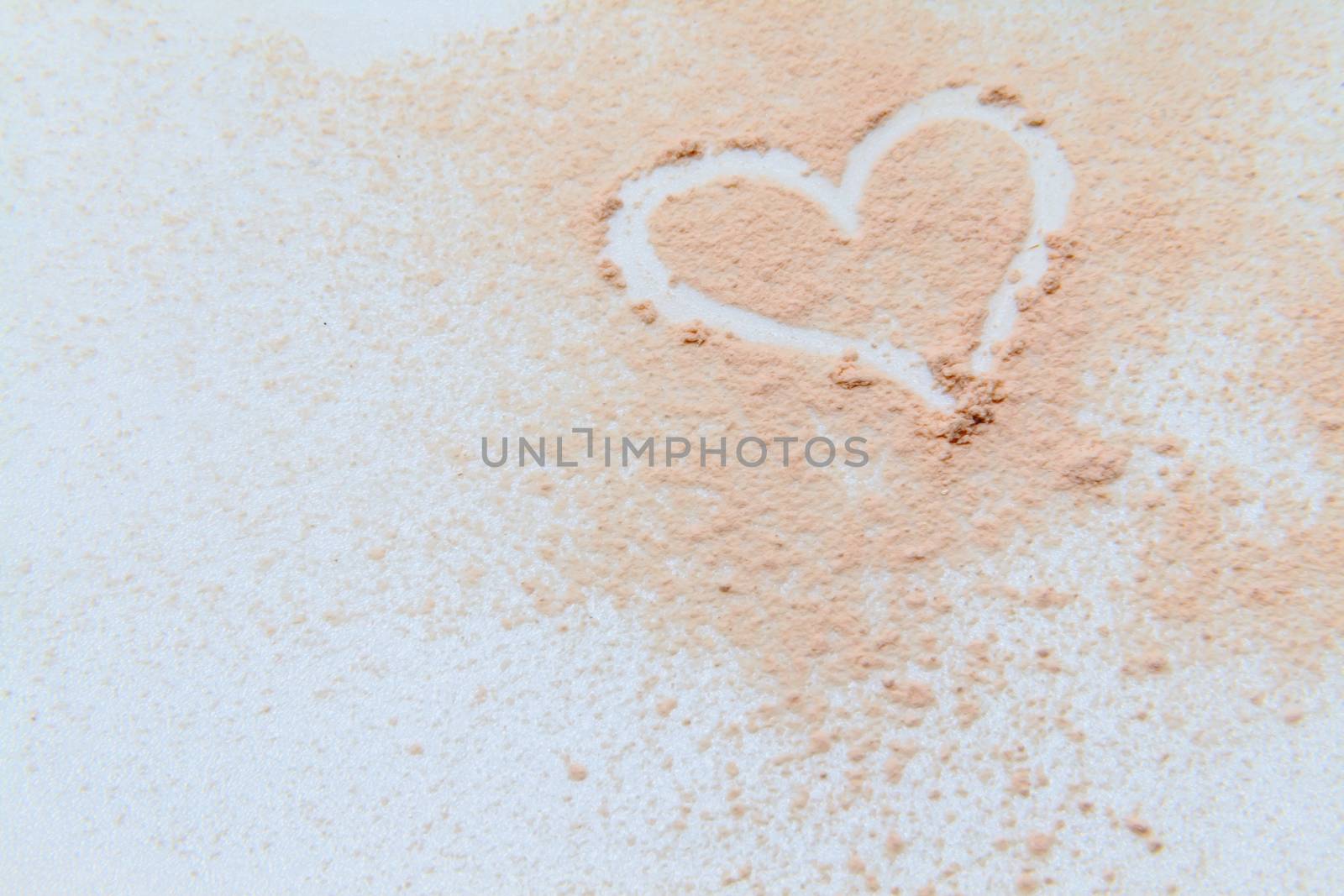 scattered powder on drawing a heart on a white background by Tanacha