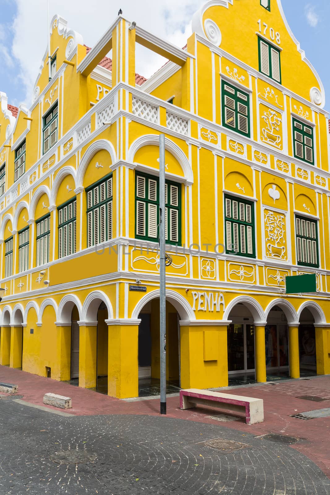 Yellow building in Willemstad in Curacao by chrisukphoto