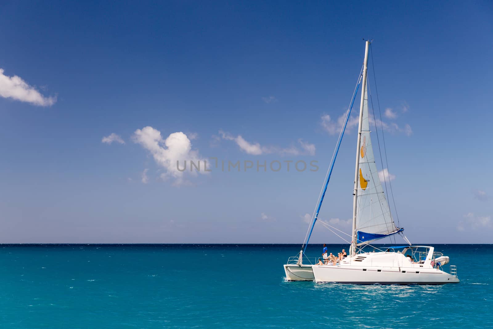 Catamaran cruising at sea in Barbados by chrisukphoto