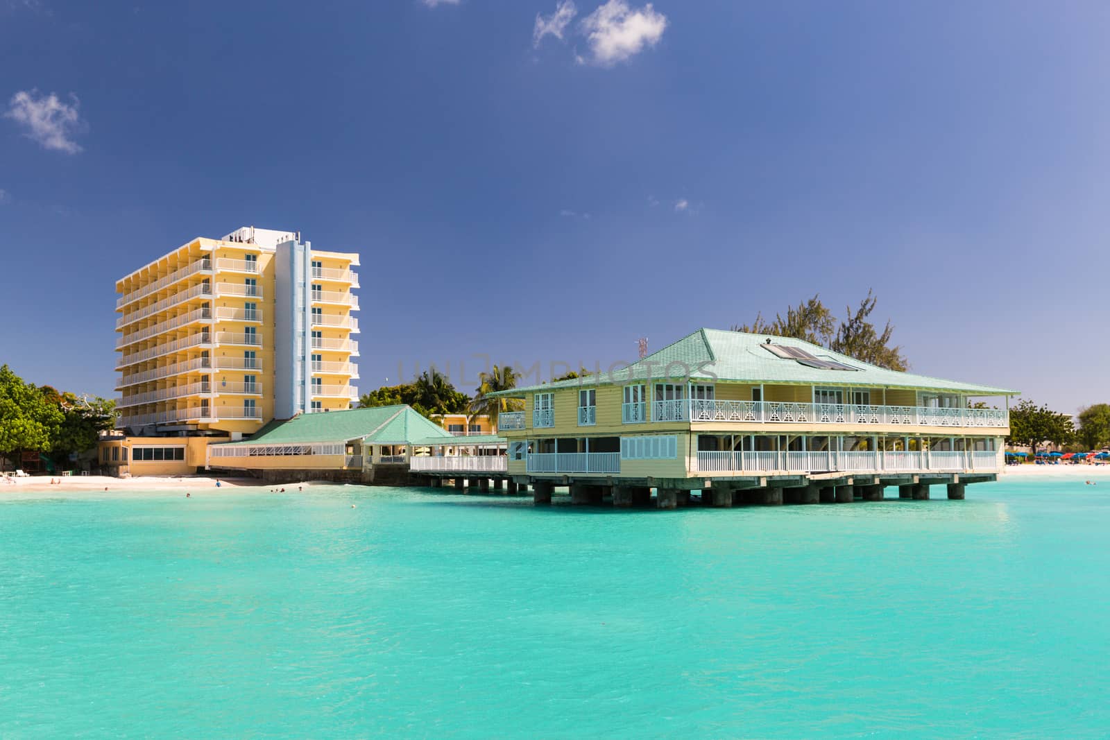View of a hotel from a Catamaran in Carlisle Bay in Barbados by chrisukphoto
