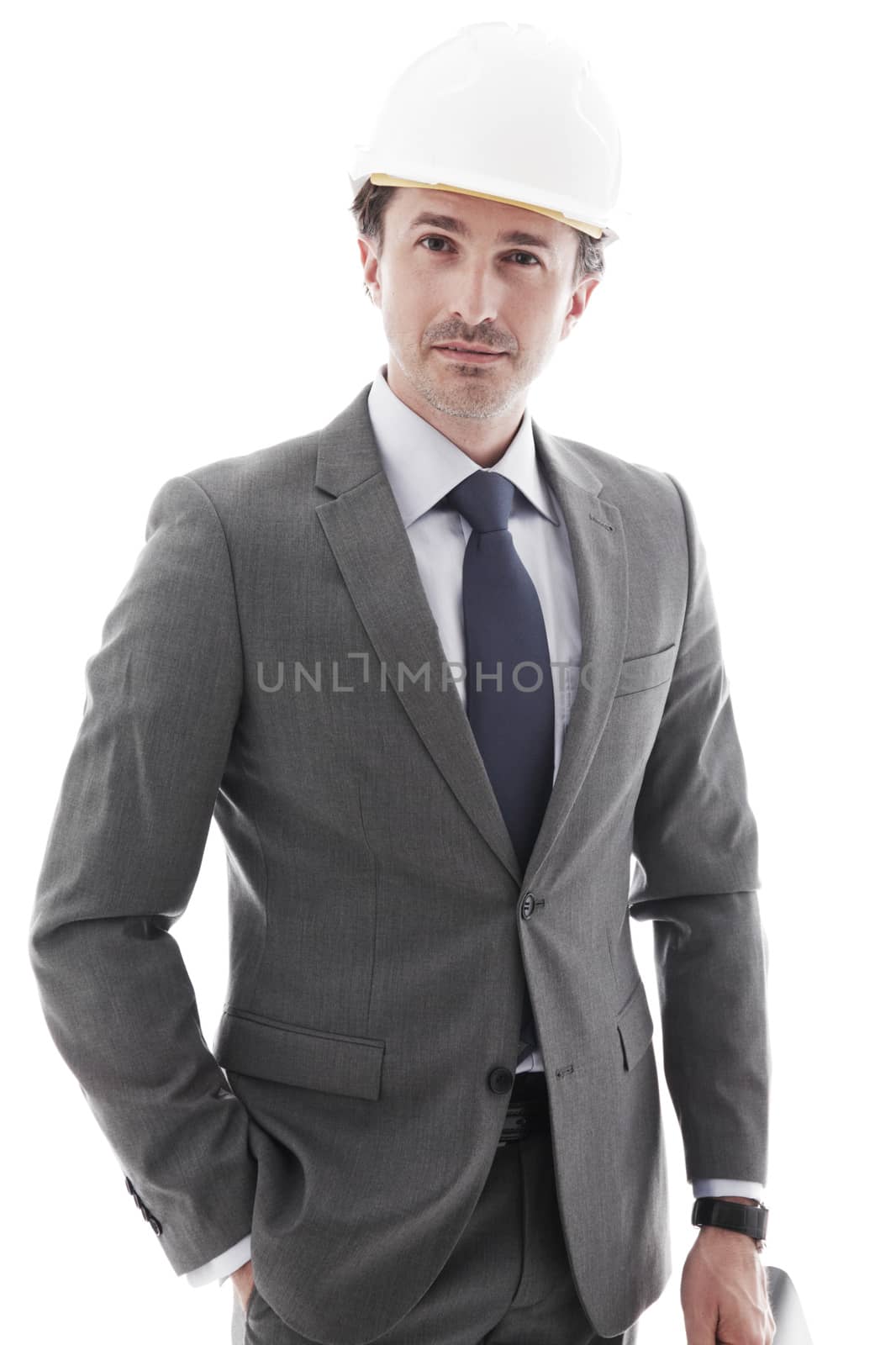 Young businessman in helmet isolated on white background