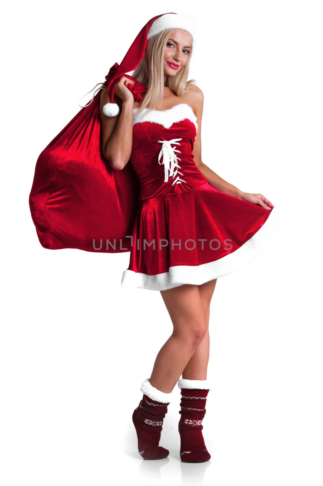 Beautiful young woman in Santa Claus clothes holding presents over Christmas background. by ALotOfPeople