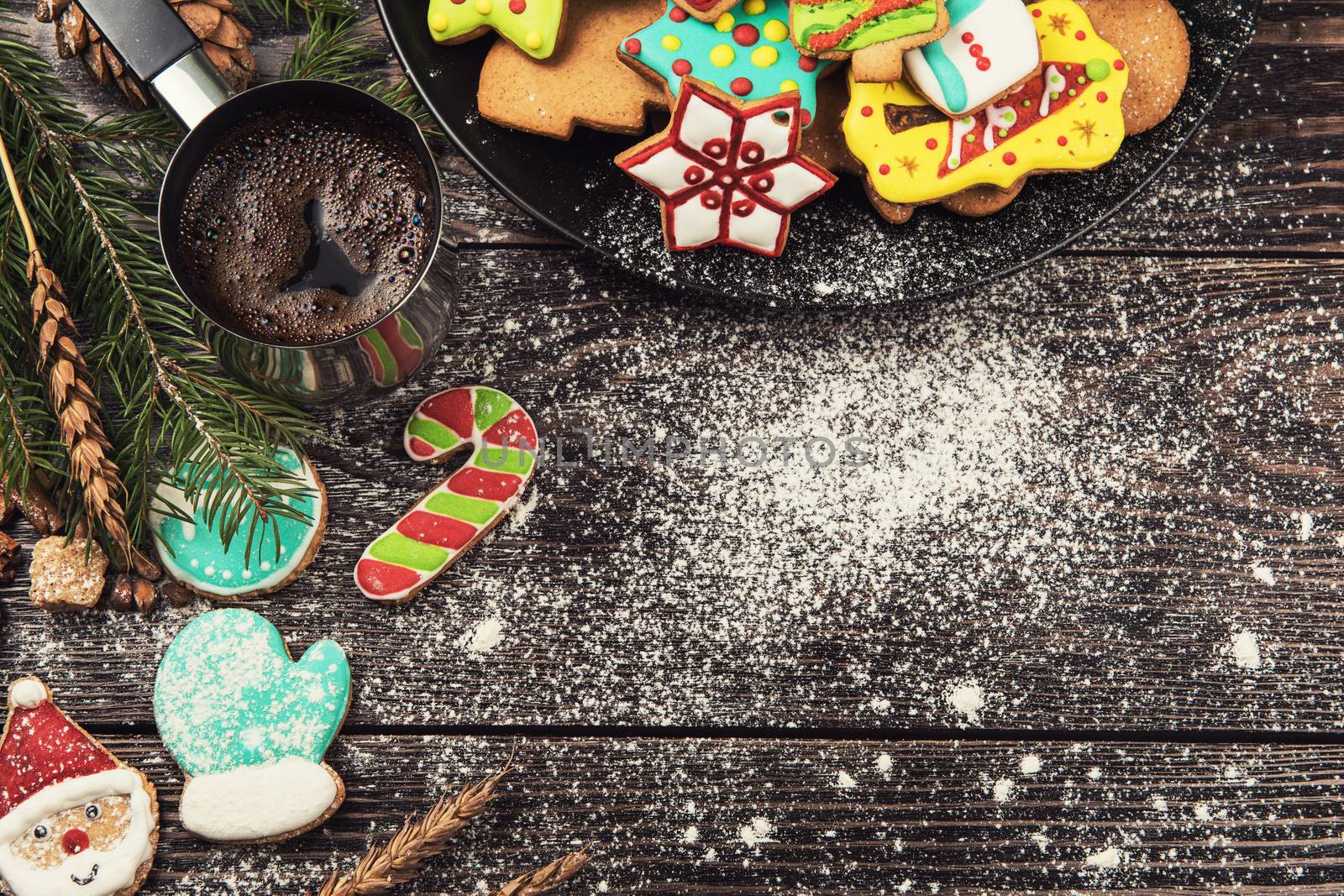 Gingerbreads and coffee for new years and christmas on wooden background, xmas theme