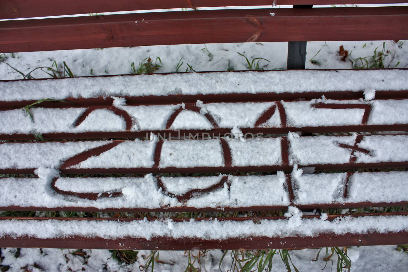 inscription on the snow on the bench digits 2017