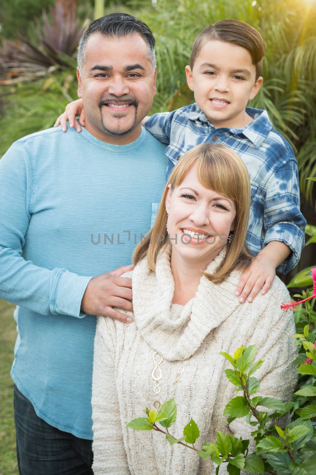 Happy Mixed Race Family Portrait Outdoors.