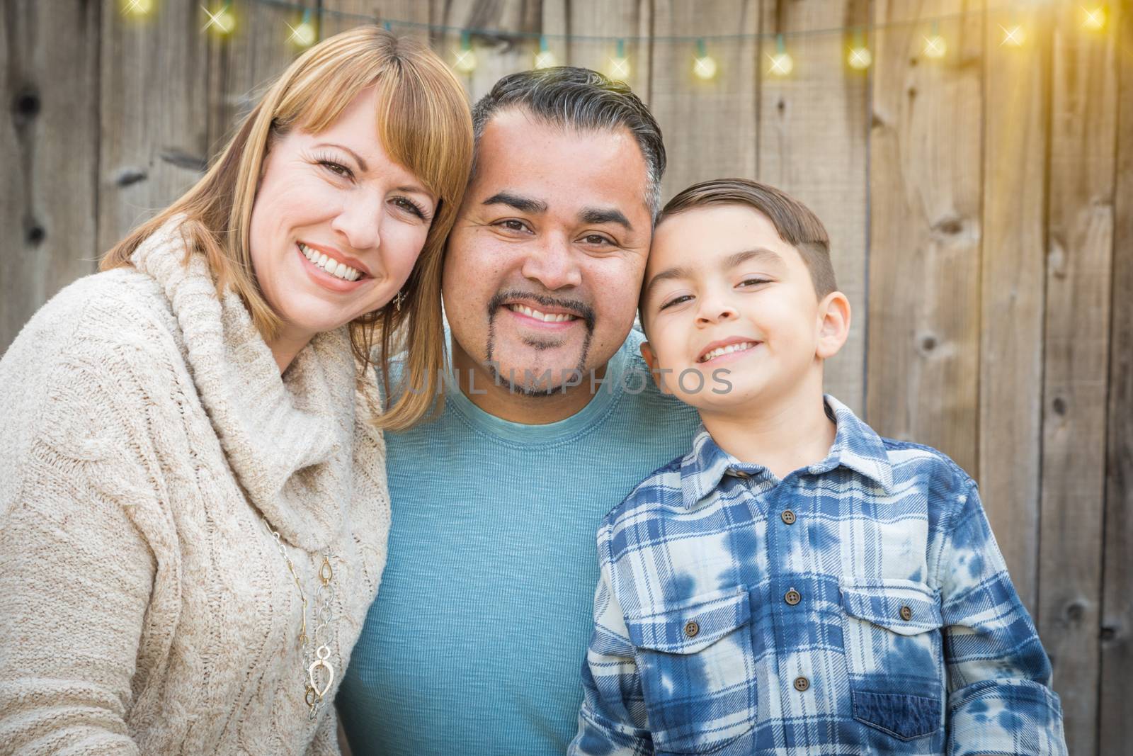 Young Mixed Race Family Portrait Outside by Feverpitched