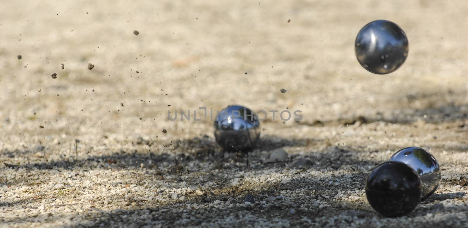 Metallic petanque three balls and a small wood jack, France