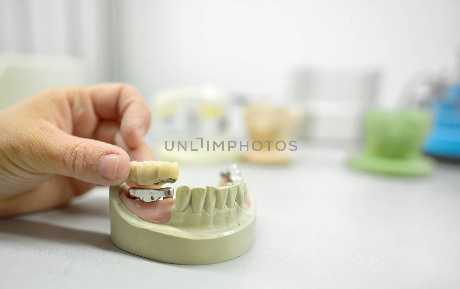 Dental technician working in dental laboratory