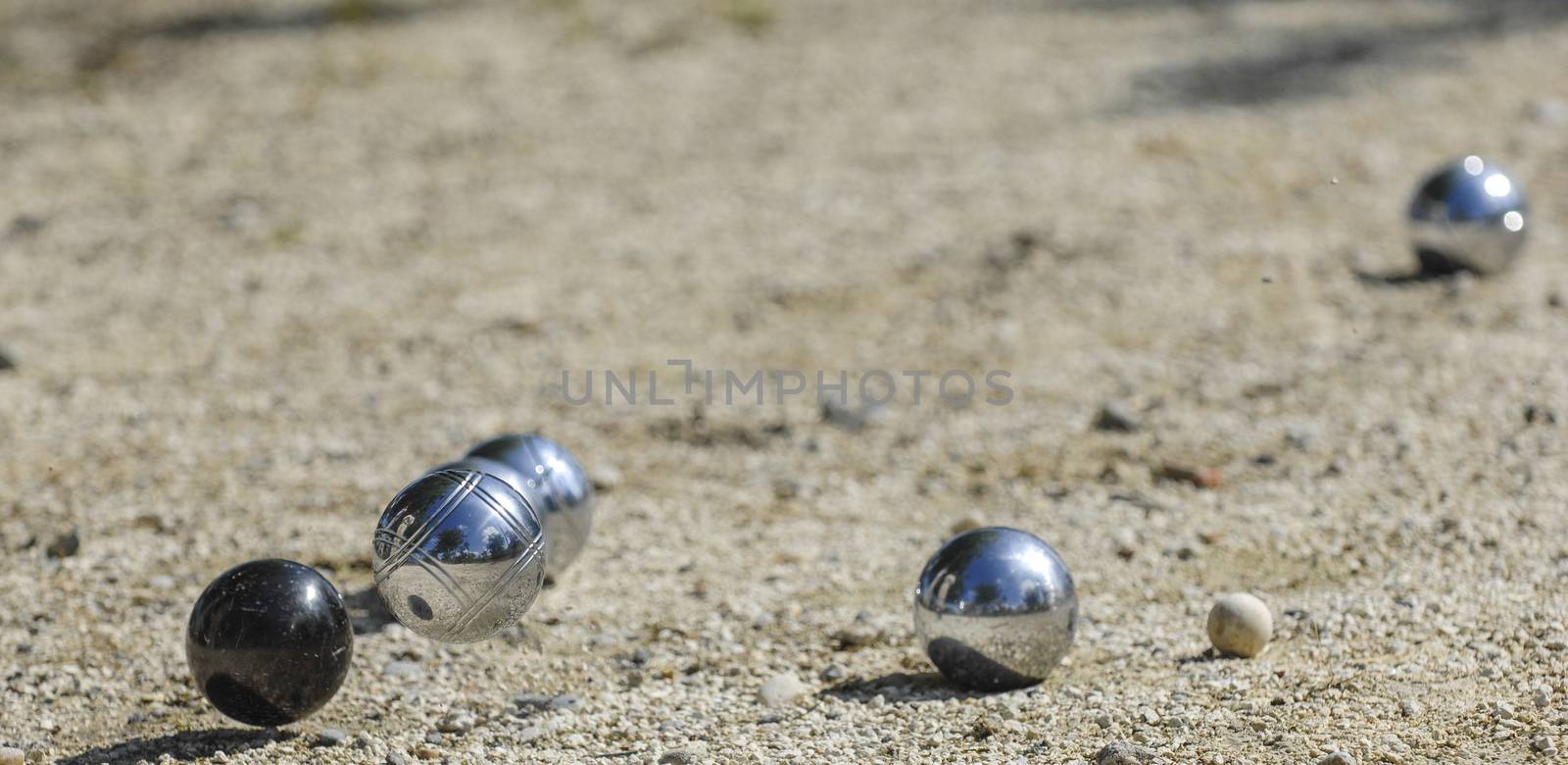 Metallic petanque three balls and a small wood jack, France